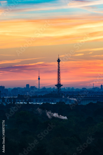 Berlin skyline with TV tower and radio tower before sunrise.