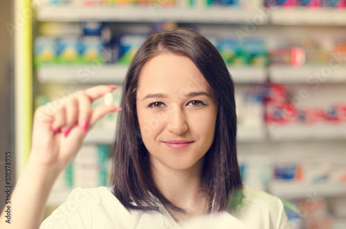 Pharmacist chemist woman show a pill. Pharmacy drugstore is background. Pretty, young woman. Pharmaceutical. Free Download Pharmacist chemist woman show a pill. Pharmacy drugstore is background. Pretty, young woman. Pharmaceutical. - GFXLoad