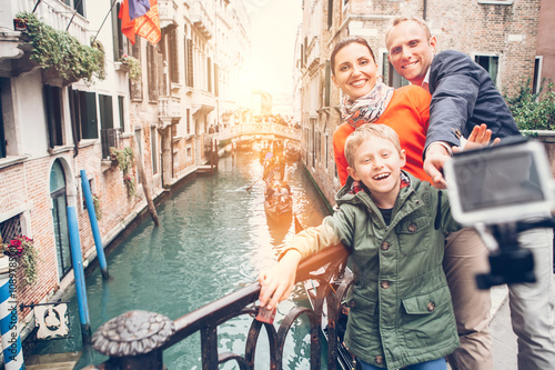 Happy family take a self photo on the bridge over Venecian chann © Soloviova Liudmyla
