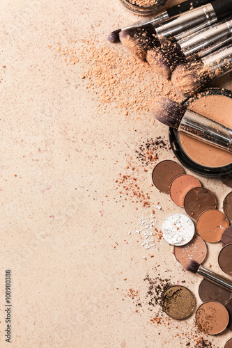 Brushes, eyeshadows and foundation powder