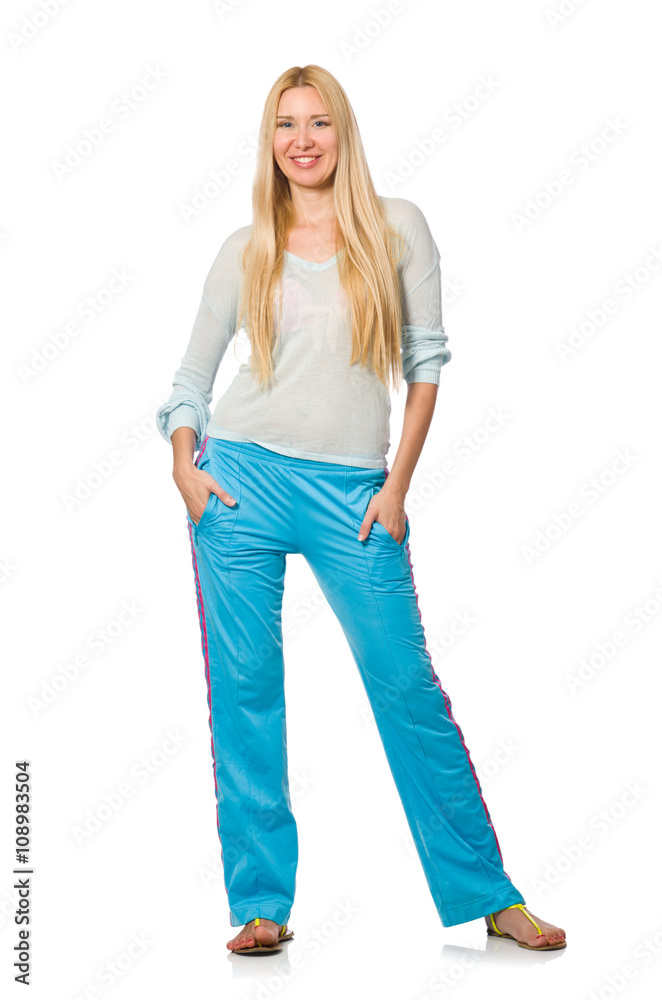 Young woman wearing blue training pants isolated on white