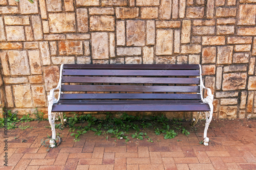 Park Bench Against Concrete Patterned Background Wall Park Bench Against Concrete Patterned Background Wall