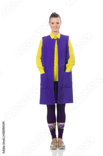 Pretty caucasian model in purple vest isolated on white