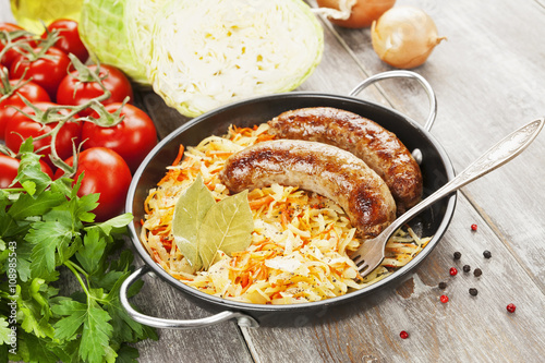 Stewed cabbage with fried sausage