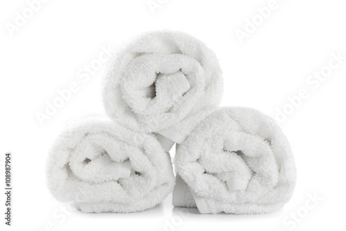 rolled up white beach towel