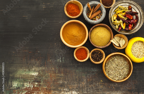 Various spices on vintage board