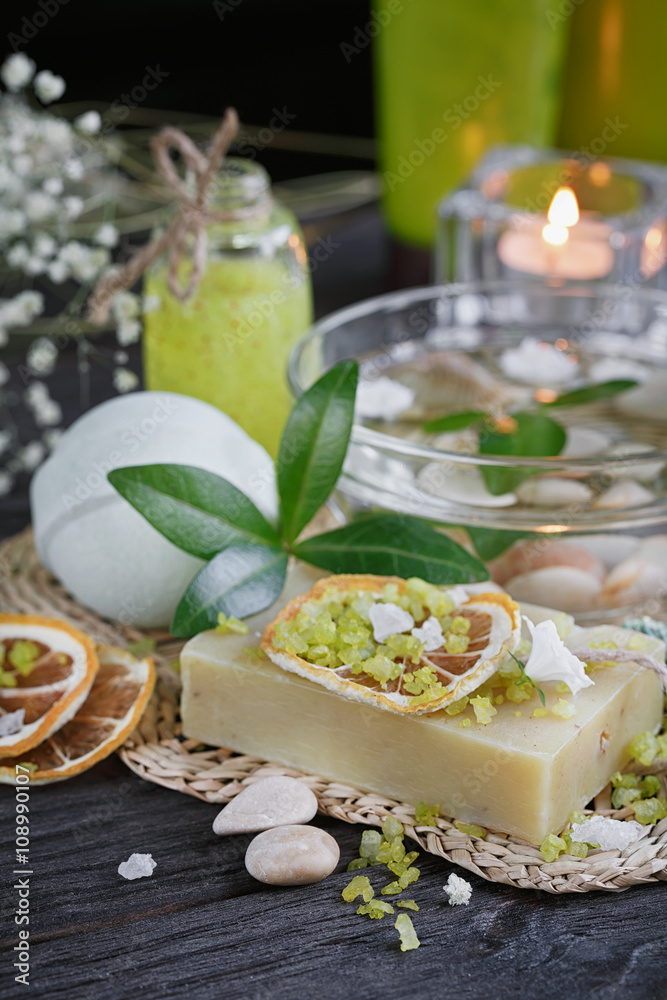 Composition of spa treatment with green salt and soap on wooden Composition of spa treatment with green salt and soap on wooden