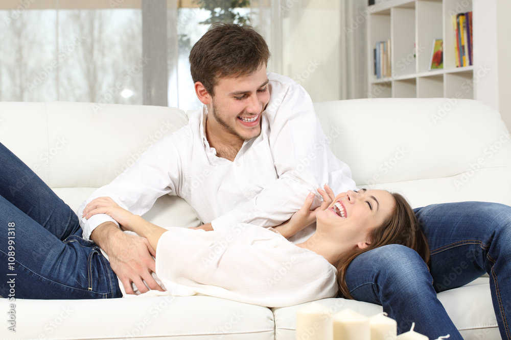 playful-couple-tickling-at-home-foto-de-stock-adobe-stock