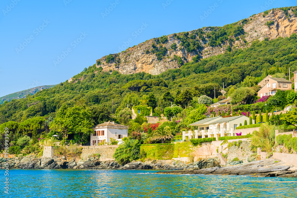 Holiday villa houses on coast of Corsica island in Erbalunga town, France