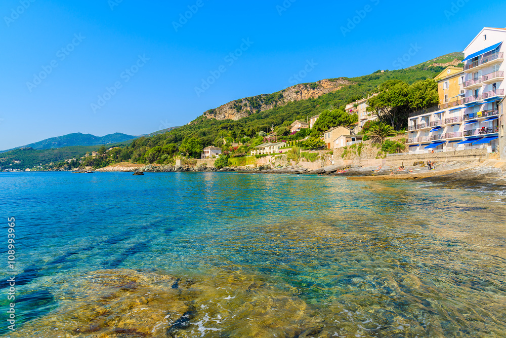 A view of beach in Erbalunga town on coast of Corsica island, France