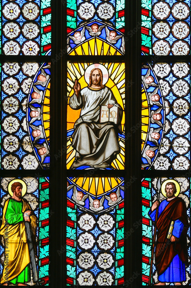 Stained Glass - Jesus holding the Holy Bible and saints