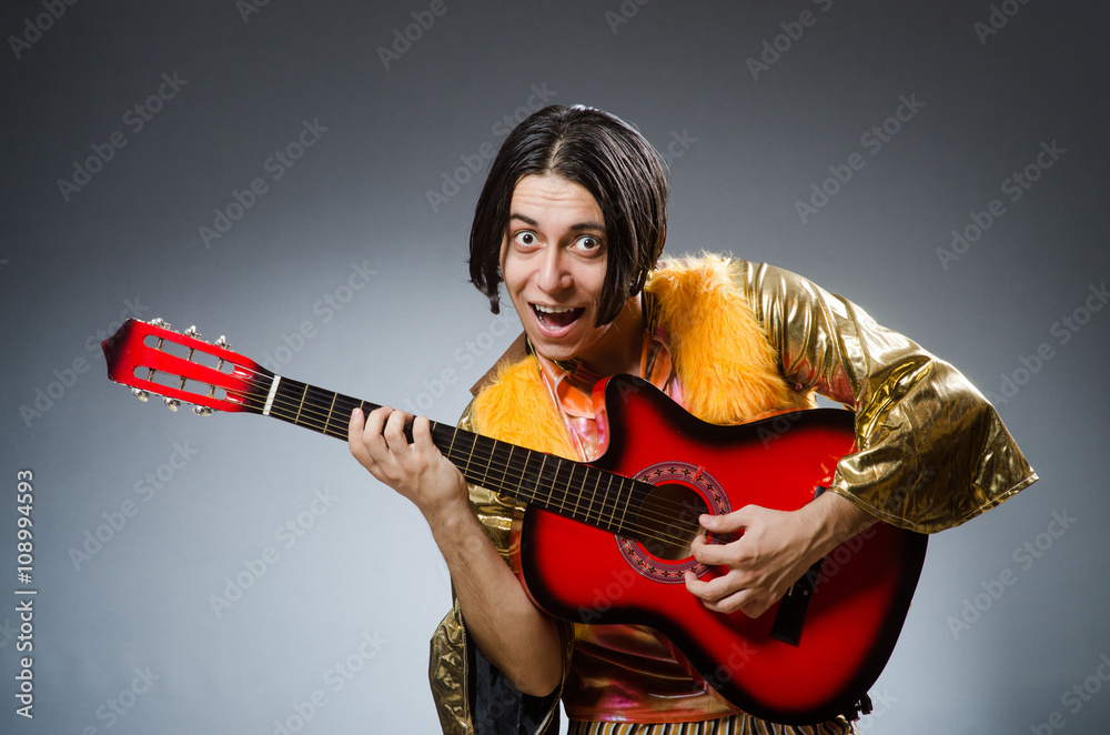 Man with guitar in musical concept Man with guitar in musical concept
