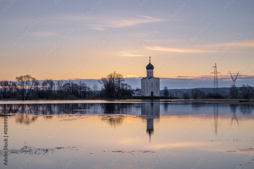 Spring landscape in the early morning with the tide in the vicinity of the temple of the Intercession on the Nerl in Vladimir region in Russia