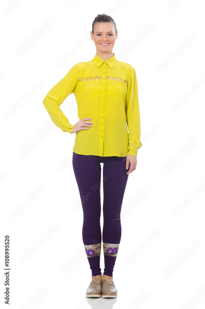 Fototapeta premium Caucasian model in purple pants and yellow blouse isolated on wh