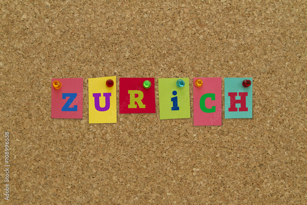 City name Zurich written on colorful sticky notes on cork board. City name Zurich written on colorful sticky notes on cork board.