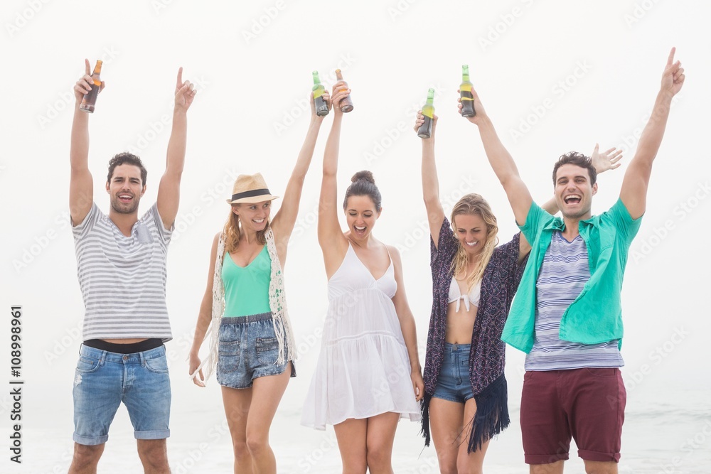 Group of friends holding beer bottle