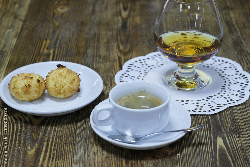 A Cup of hot coffee with biscuits and brandy A Cup of hot coffee with biscuits and brandy