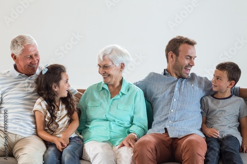 Happy family sitting on sofa © WavebreakMediaMicro