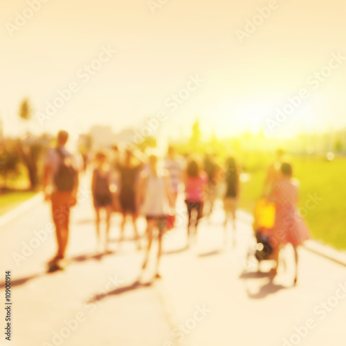 Blurred image of people walking on the street.