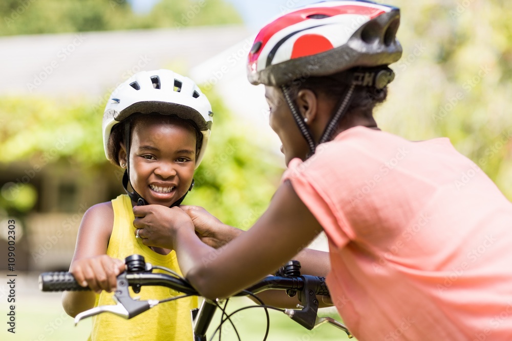 Naklejka premium Happy family wearing a helmet