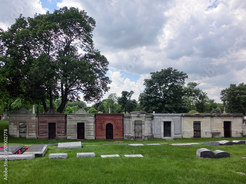 Ominous row of cemetery tombs - landscape color photo © jryanc10
