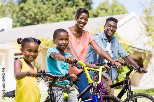 Happy family doing bicycle