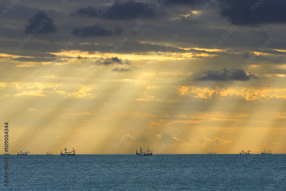 Naklejka premium The Return Of Fishing Vessels - Fishing Vessels are preparing to return home in the afternoon with lovely sunrays