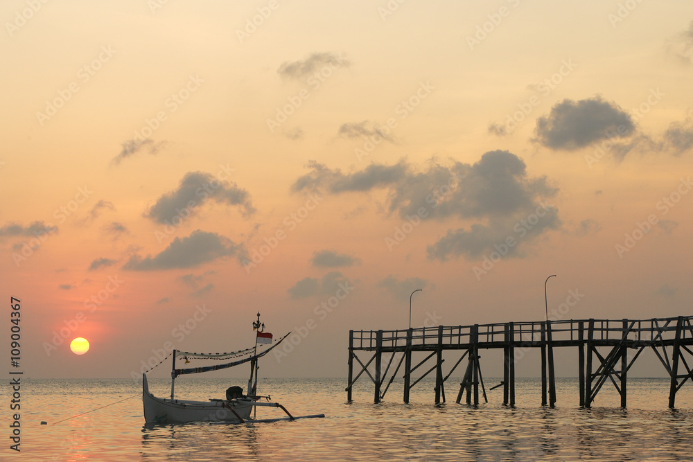 Boat In The Sunset - Fishing boat is leaning on the sea in the sunset Boat In The Sunset - Fishing boat is leaning on the sea in the sunset