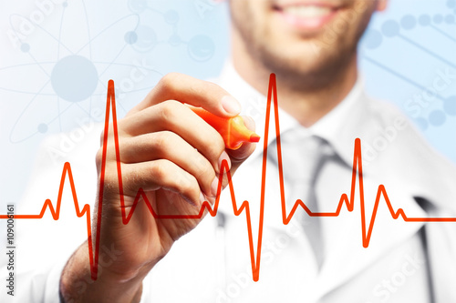 Doctor drawing cardiogram o...