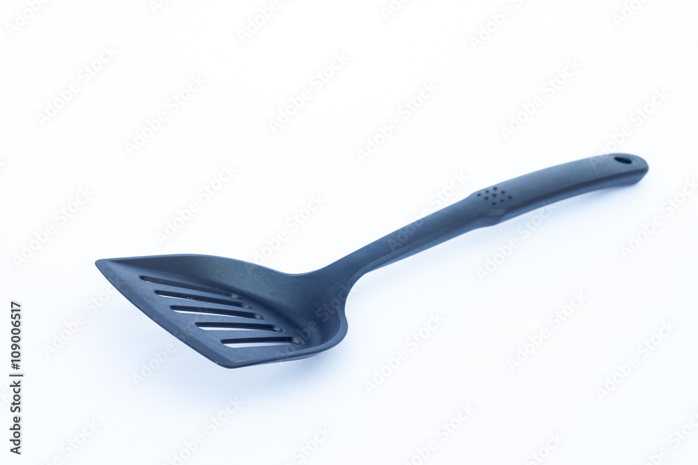 Black plastic kitchen spatula on white background Black plastic kitchen spatula on white background
