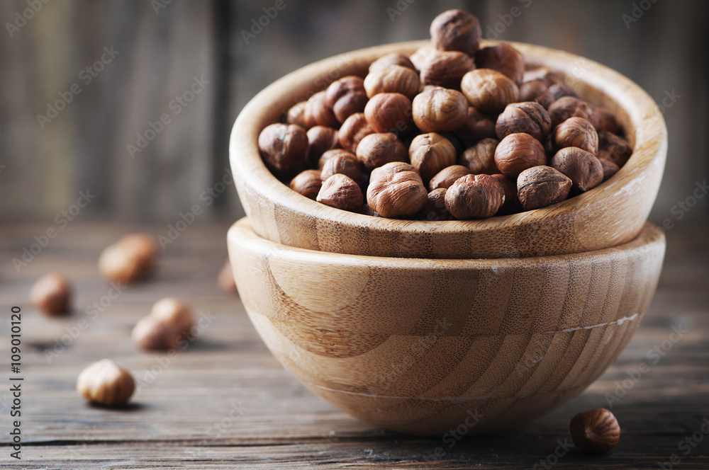 Raw hazelnut on the wooden table Raw hazelnut on the wooden table