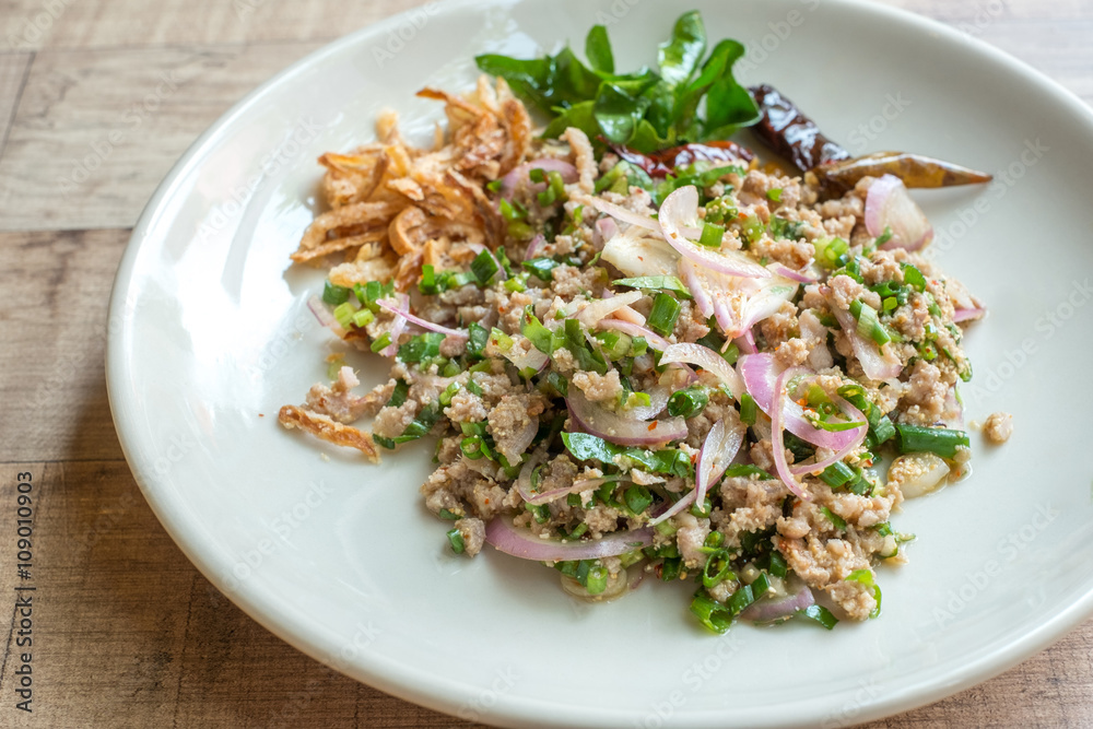 Pork Larb is minced pork cook in Thai style and it is very hot and spicy Pork Larb is minced pork cook in Thai style and it is very hot and spicy