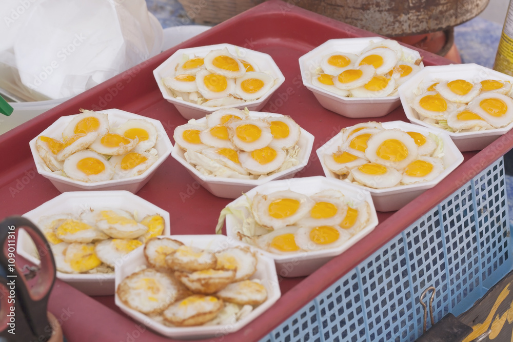 Fried Quail's egg on styrofoam plate , Thai style Fried Quail's egg on styrofoam plate , Thai style