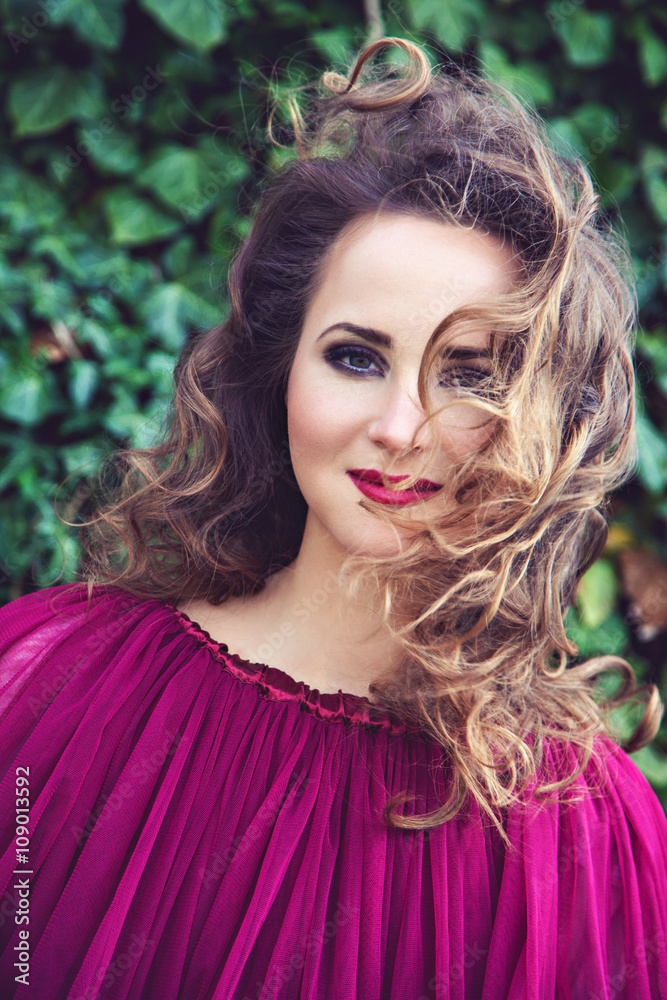 Brunette woman with curly hairstyle and sexy red lips Brunette woman with curly hairstyle and sexy red lips