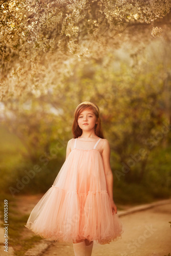 cute little girl in a spring garden