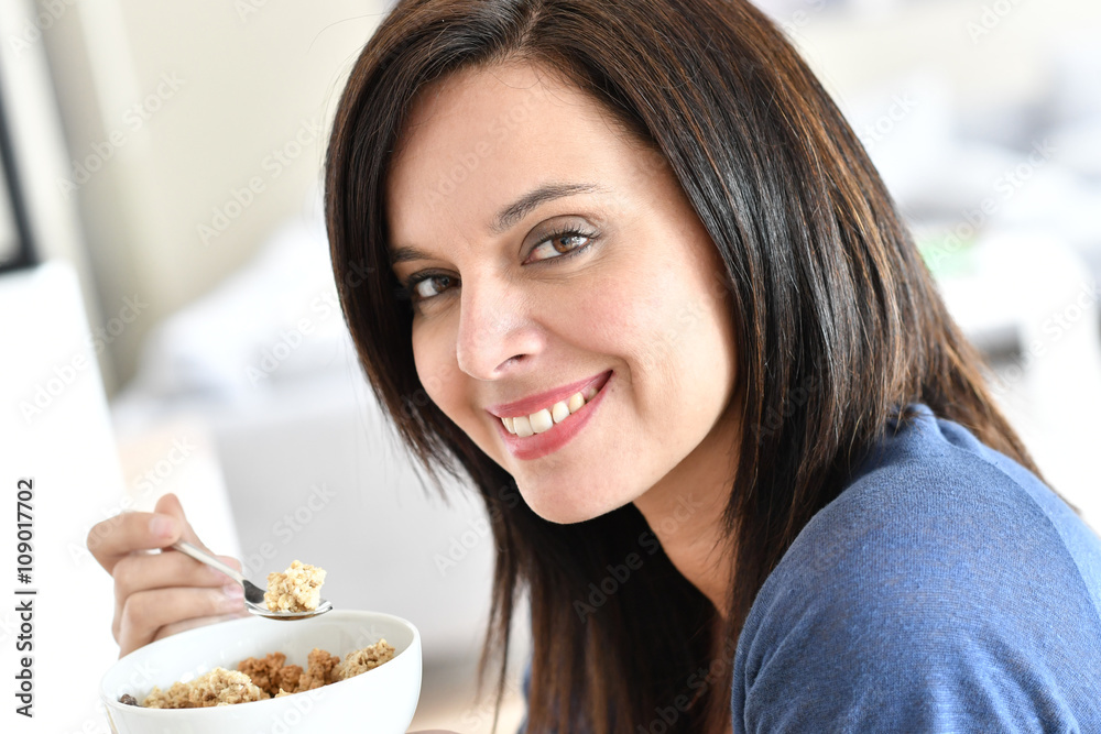 Portrait of mature woman eating cereals Portrait of mature woman eating cereals