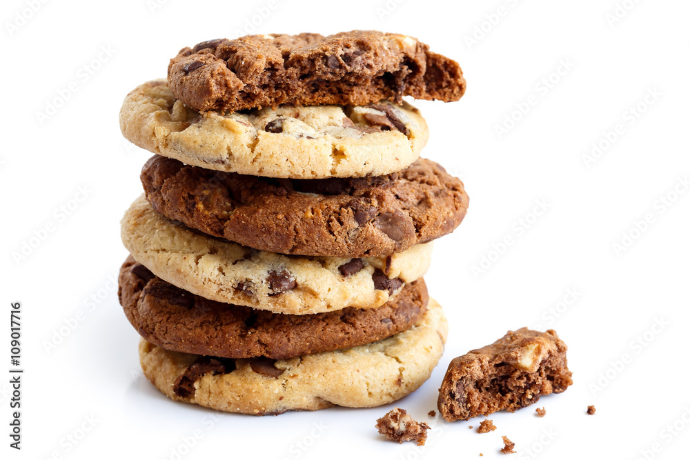 Stack of light and dark chocolate chip cookies isolated. One bro Stack of light and dark chocolate chip cookies isolated. One bro