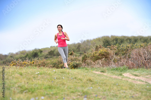 Woman running in the countryside