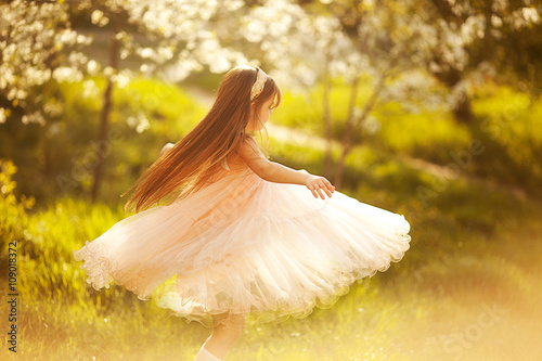 cute little girl in a spring garden
