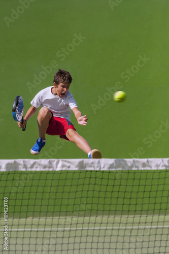 Young man jumps, playing paddle © fresnel6