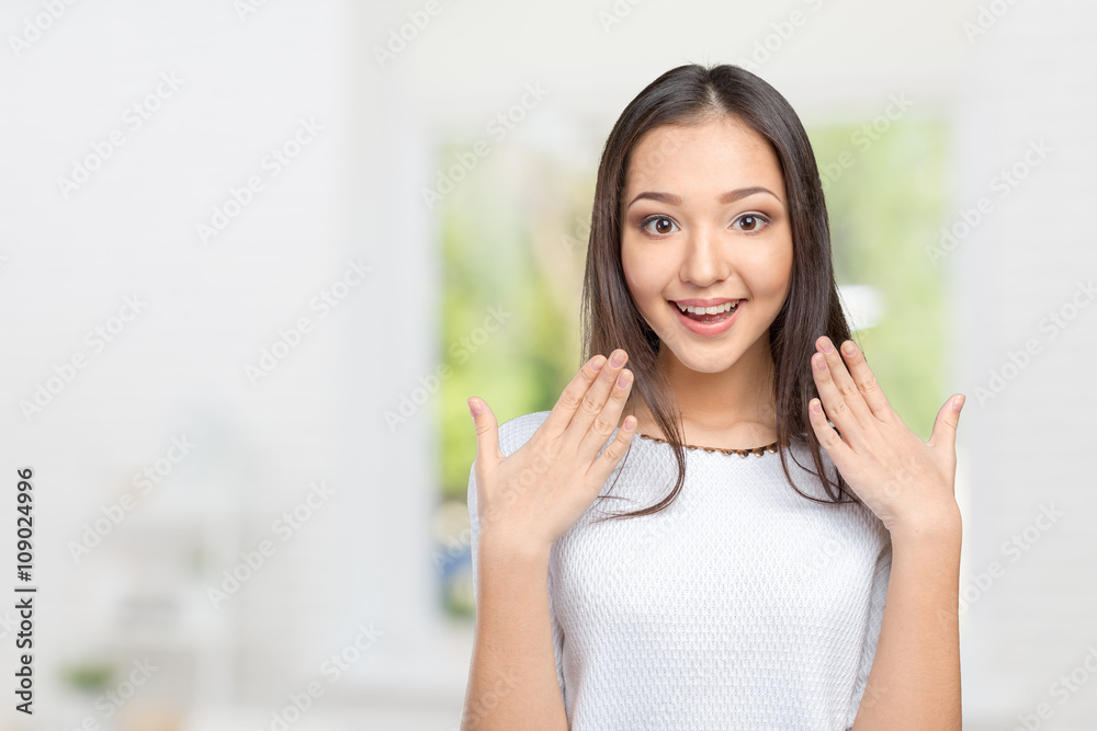 Surprised businesswoman with hands up amazed or shocked by unexpected news