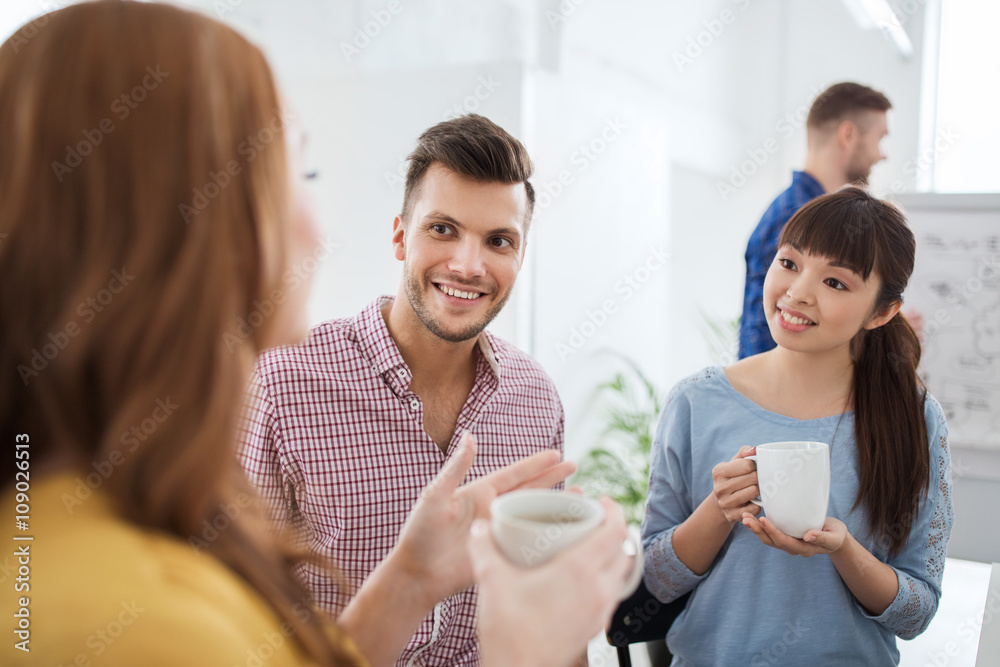 happy creative team drinking coffee at office happy creative team drinking coffee at office