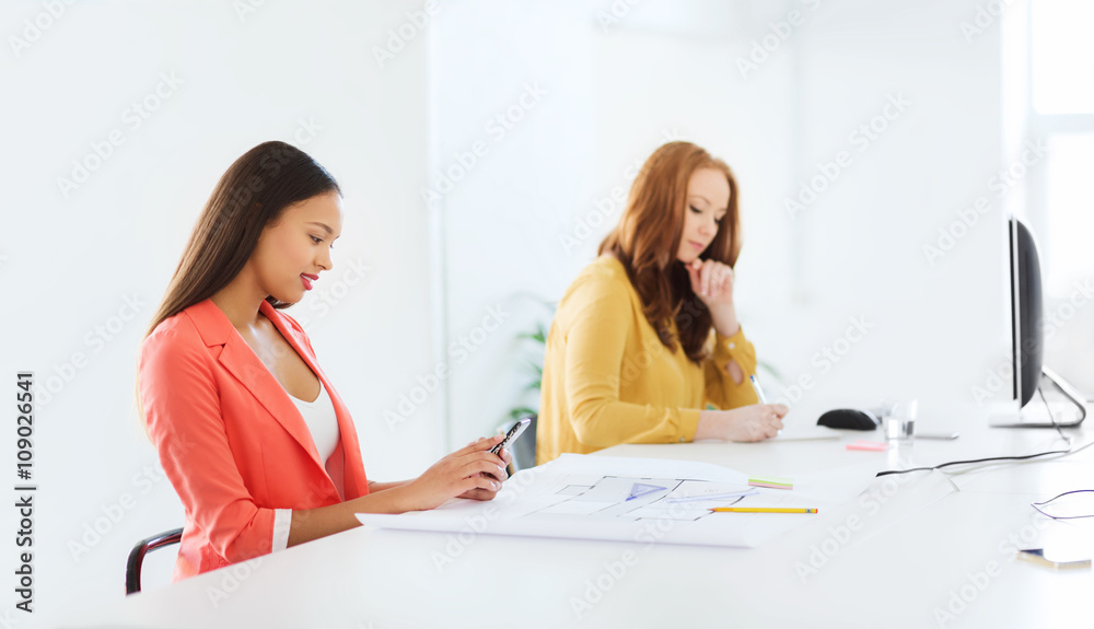 businesswoman texting on smartphone at office businesswoman texting on smartphone at office