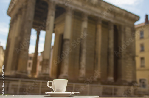 Cup of hot morning coffee at the table of cafe in Rome