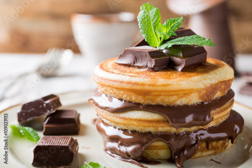 Homemade pancakes with chocolate spread.