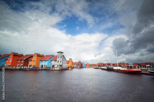 colorful buildings on water, yach and boats