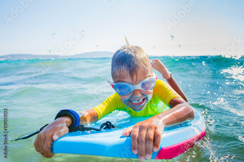 Little boy surfboarding