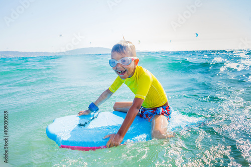 Little boy surfboarding