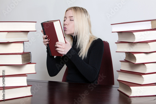 woman kissing a book