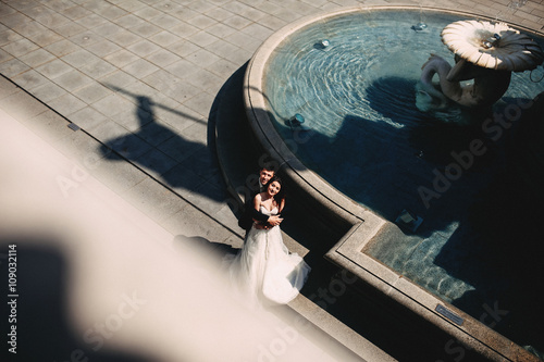 Photography Couple in love is near fountain